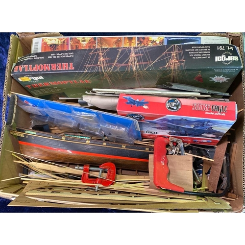 244 - Big box of model making tools, kits and equipment, including a boat hull and wood strips.