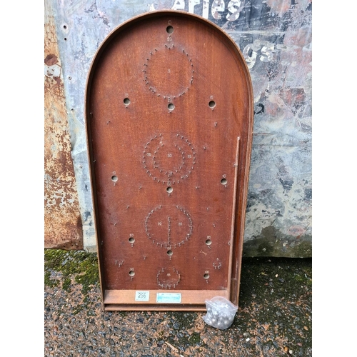 256 - Antique bagatelle game with balls.