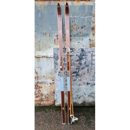 258 - Set of vintage Norwegian wooden skis and poles.