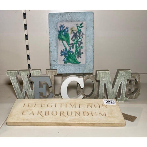 282 - Hand Painted stone wall plaque, resin ‘welcome’ sign and a mock Latin carved stone plaque approx W35... 