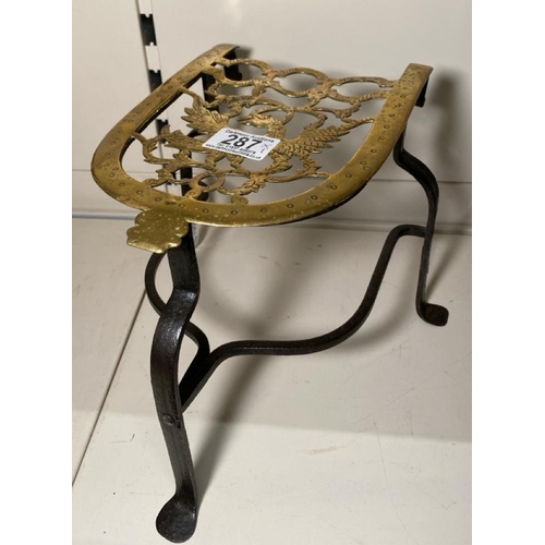 287 - Antique 18th century tripod trivet with hand forged cast iron legs and brass plate intricately decor... 