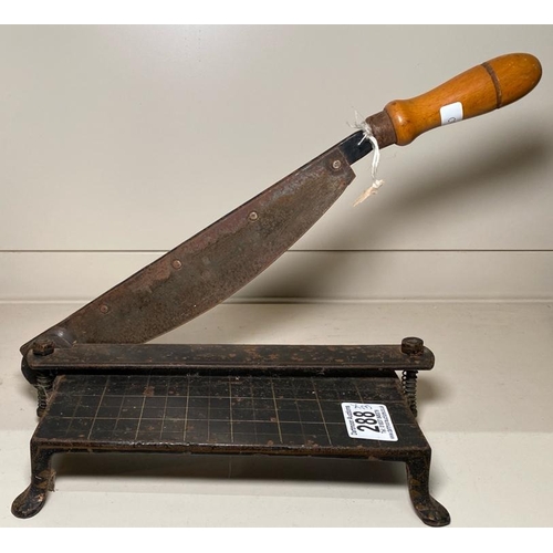 288 - Antique brass and cast iron trivet, set of GPO scales with weights and a small antique guillotine.
