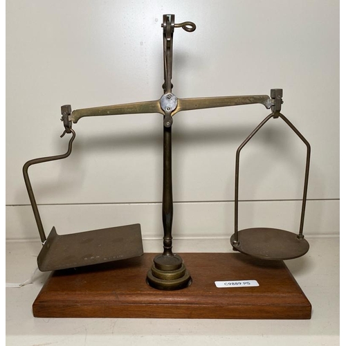 288 - Antique brass and cast iron trivet, set of GPO scales with weights and a small antique guillotine.