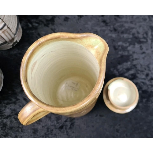 322 - Two studio Pottery tea pots, (makers’ mark to base of handle), Vellow pottery coffee pot, pale blue ... 
