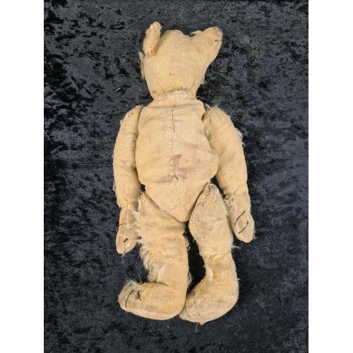 324 - Farnell’s Alpha toys antique jointed teddy bear, original badge still on foot, very loved, missing s... 