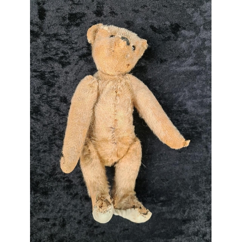 327 - Antique small straw filled teddy bear with the remains of a growler inside (not working), glass bead... 