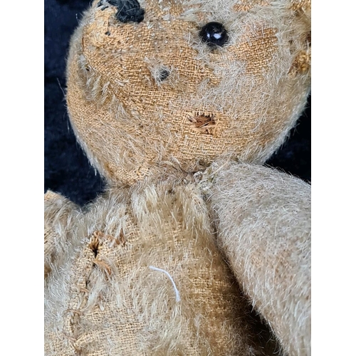 327 - Antique small straw filled teddy bear with the remains of a growler inside (not working), glass bead... 