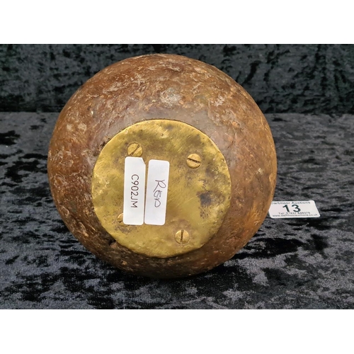 13 - Round mahogany doorstop with ornate brass handle. Approx H30cm.