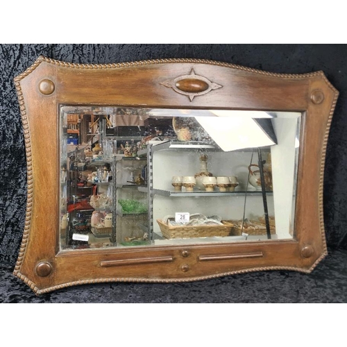 28 - Early 20th-century oak framed bevel-edge mirror with decorative rope-style trim. Frame approx H62cm ... 