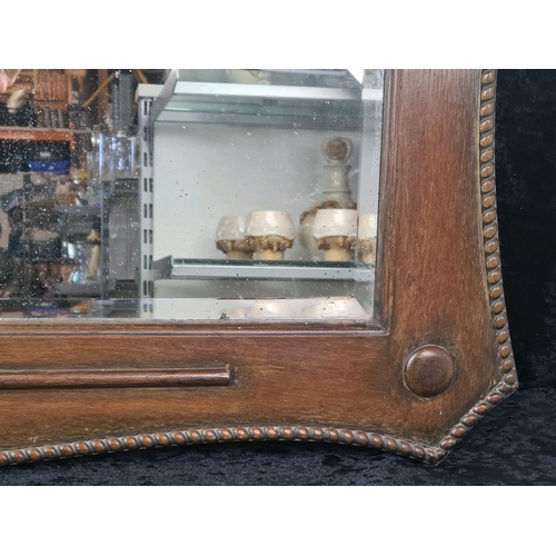 28 - Early 20th-century oak framed bevel-edge mirror with decorative rope-style trim. Frame approx H62cm ... 