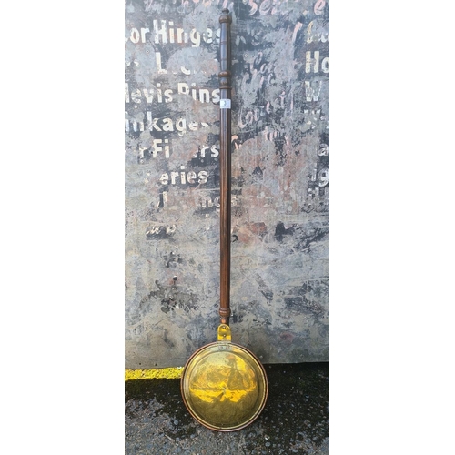 3 - Antique copper and brass bed warming pan with embossed lid with intricate decorative patterns.