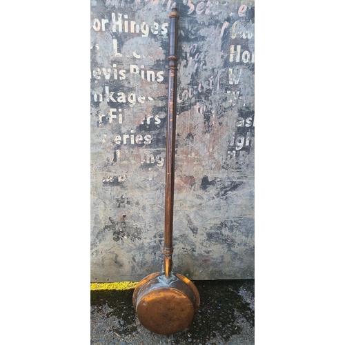 3 - Antique copper and brass bed warming pan with embossed lid with intricate decorative patterns.