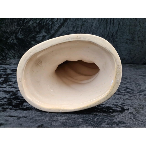 31 - Tall, white glazed ceramic figurine of a woman wearing a flowing dress and holding her hat. Approx H... 