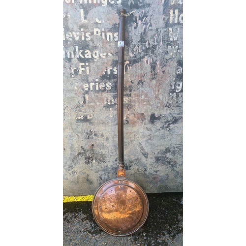 4 - Victorian copper bed warming pan with a repoussé pattern and punched holes to allow heat to escape.