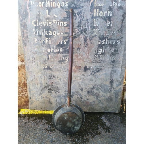 4 - Victorian copper bed warming pan with a repoussé pattern and punched holes to allow heat to escape.