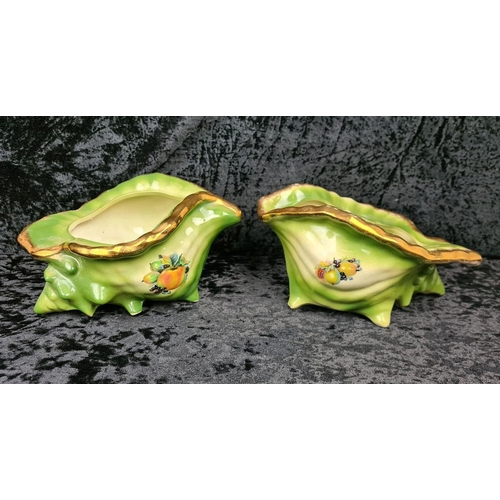 41 - Pair of kitsch Victorian-style decorative ceramic planters shaped like conch shells, with a green gl... 