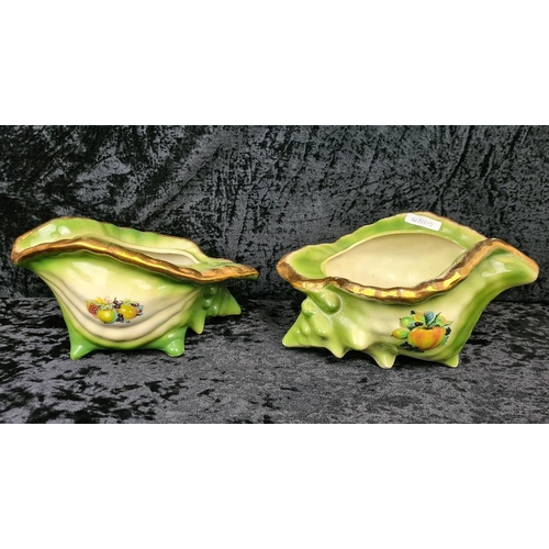 41 - Pair of kitsch Victorian-style decorative ceramic planters shaped like conch shells, with a green gl... 