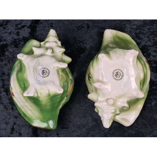 41 - Pair of kitsch Victorian-style decorative ceramic planters shaped like conch shells, with a green gl... 