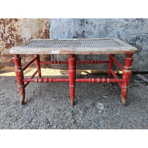 43 - Charming antique bergere cane two-seater stool/bench. Approx H26 x W69 x D37cm.