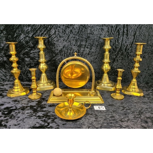 6 - Selection of brass candlesticks plus a table gong - just what you need for a candle-lit supper!