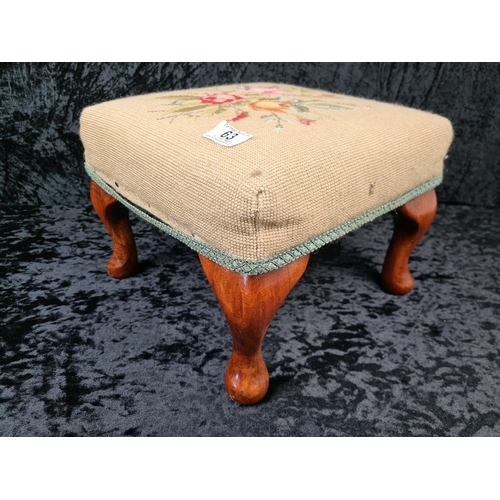 63 - Small Victorian floral design needlepoint footstool with wooden cabriole legs.