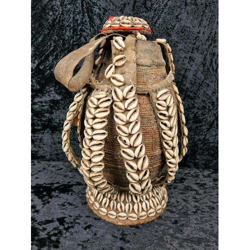 77 - Traditional Ethiopian milk/water container - a cowrie shell adorned woven vessel, often referred to ... 