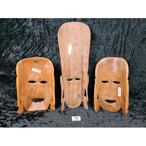 78 - Three hand-carved wooden African tribal masks. Tallest approx H40cm.