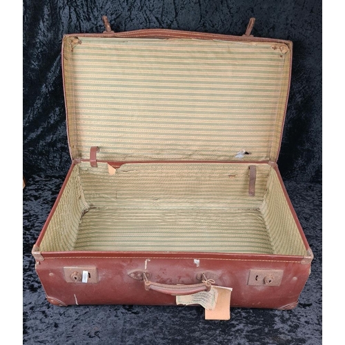 83 - Good pair of vintage brown leather suitcases, both handles intact. Largest approx W65 x D39cm.