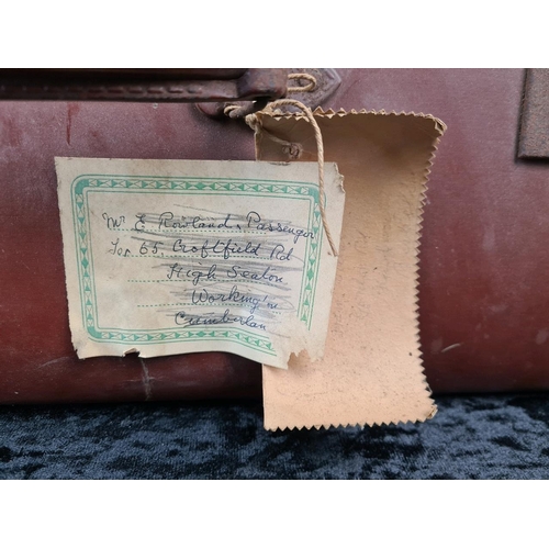83 - Good pair of vintage brown leather suitcases, both handles intact. Largest approx W65 x D39cm.