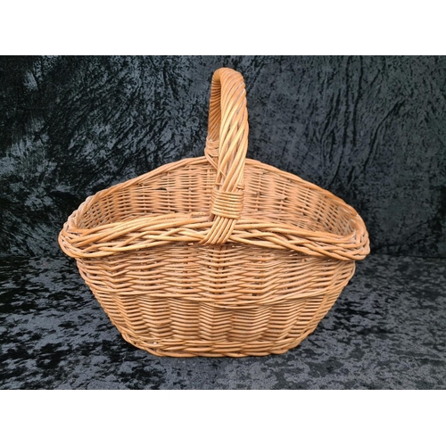 84 - Solid and sturdy large wicker basket.