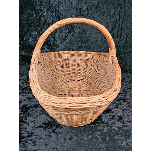 84 - Solid and sturdy large wicker basket.