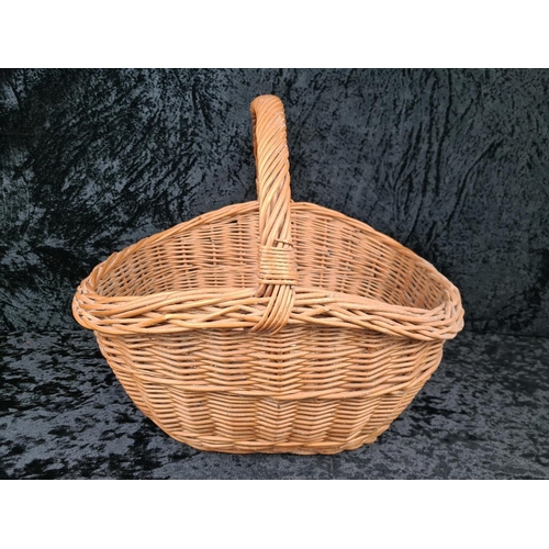 84 - Solid and sturdy large wicker basket.