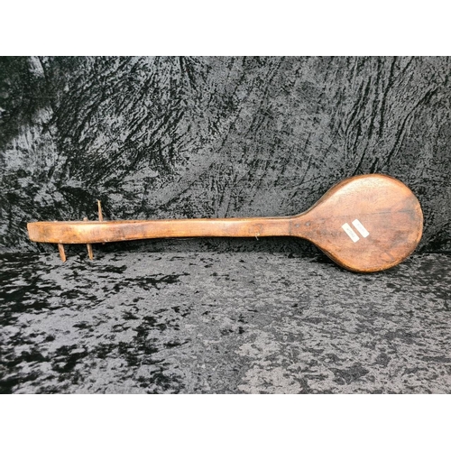 97 - Traditional carved wooden northern lute, most likely Thai. Approx L79cm.