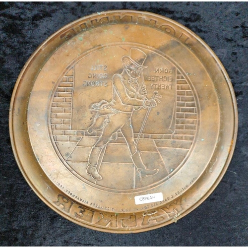 105 - 1930s embossed copper Johnnie Walker whisky serving drinks tray. Approx Dia34cm.