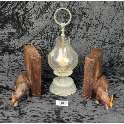 108 - Pair of late 1950s hand-carved hardwood rhino bookends (one has slight damage to tusk), and a little... 