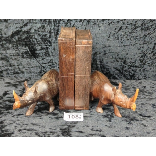 108 - Pair of late 1950s hand-carved hardwood rhino bookends (one has slight damage to tusk), and a little... 