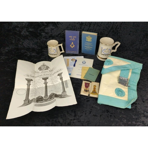 115 - Selection of Masonic items from various Lodges including mugs, medals and a blue leather apron.