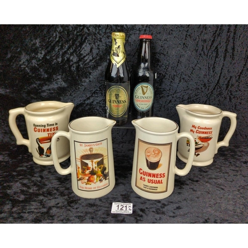 121 - Guinness goodies galore - two commemorative bottles, and four jugs with different designs.