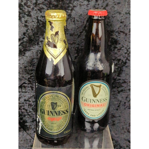 121 - Guinness goodies galore - two commemorative bottles, and four jugs with different designs.