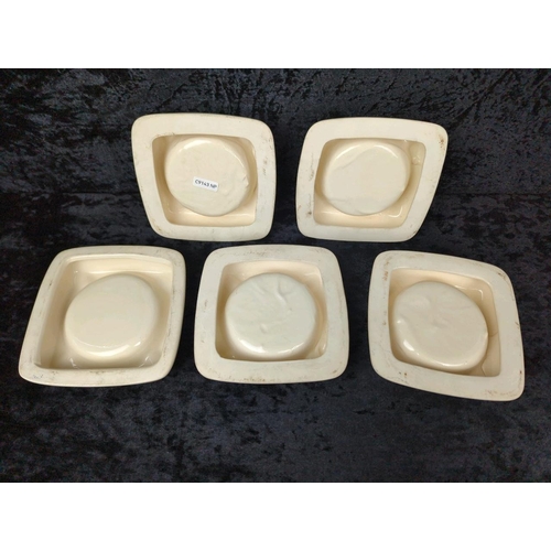 122 - Five vintage Guinness ashtrays with different designs.