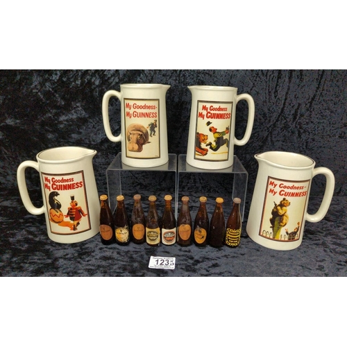 123 - Four vintage Guinness jugs and a collection of miniature bottles, all unopened.