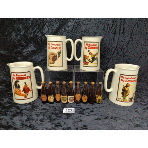 123 - Four vintage Guinness jugs and a collection of miniature bottles, all unopened.
