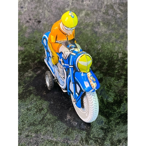 133 - Two vintage tinplate motorcycles, one boxed, made in China.