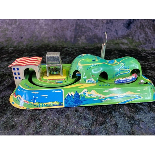 134 - Two vintage tinplate toys - train and clockwork island, both boxed, made in China.