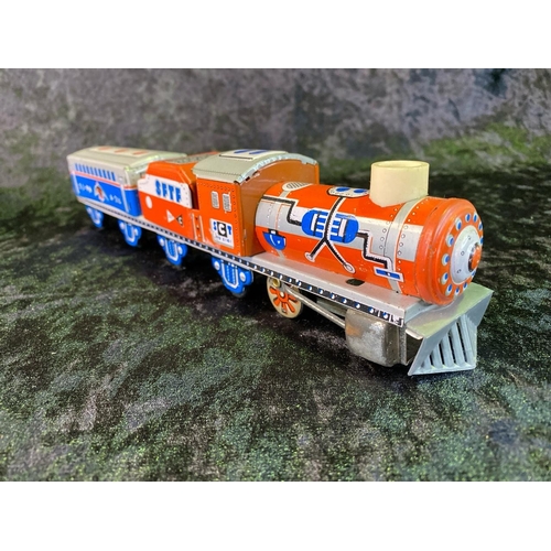 134 - Two vintage tinplate toys - train and clockwork island, both boxed, made in China.