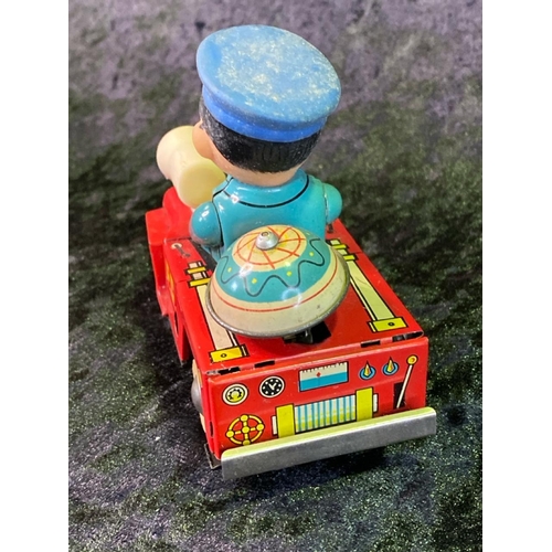 135 - Three vintage tinplate toys, 'fire chief', 'ice cream truck' made in China, and 'ringing tricycle' m... 