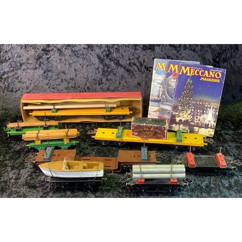 146 - Hornby 0 gauge Meccano timber transporting goods wagons and three 1950s Meccano magazines, five smal... 