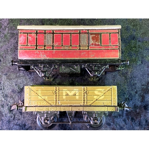 147 - Hornby 0 gauge Meccano GW and LMS goods wagons and one carriage - nine in total.