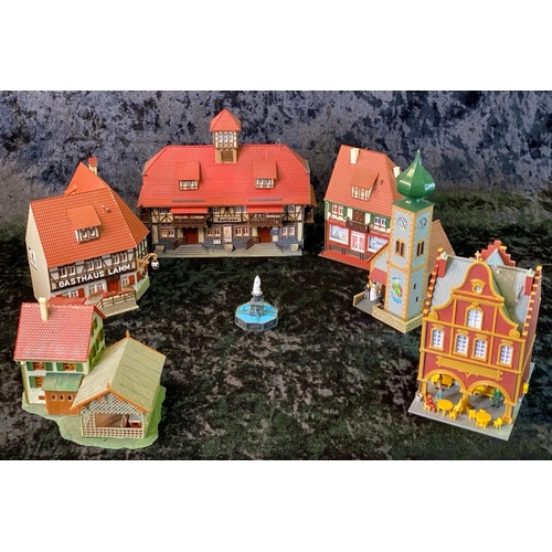 159 - H0 gauge plastic train layout models, German style pubs, shops and a church wedding! Total of seven ... 