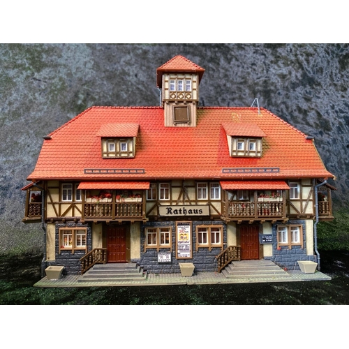 159 - H0 gauge plastic train layout models, German style pubs, shops and a church wedding! Total of seven ... 
